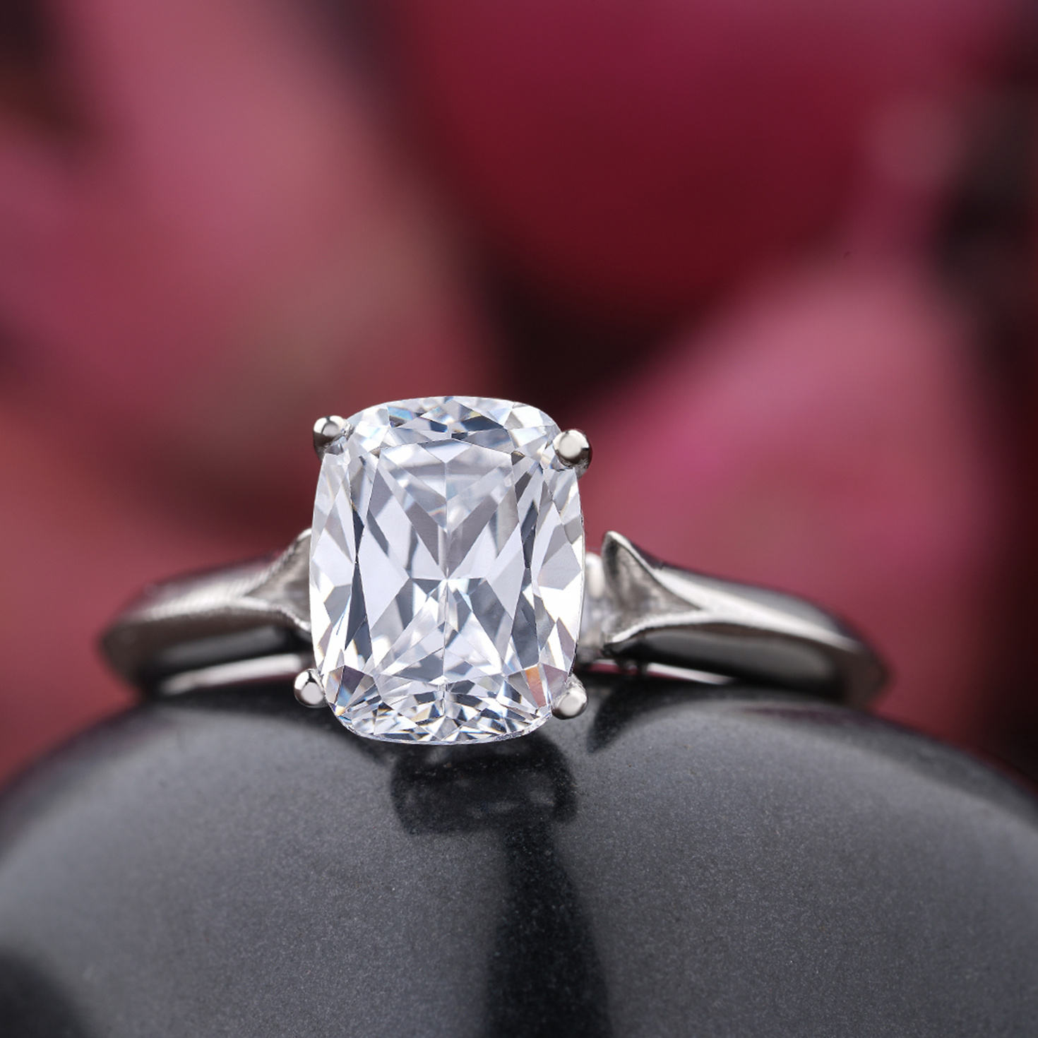 Silver Diamond Ring on Black Stone